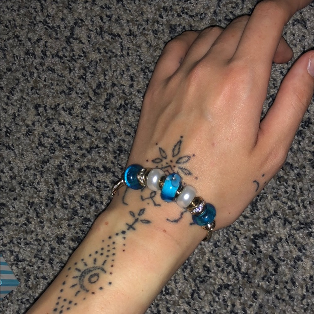 Bella Perlina blue, pearl, and gold bracelet.